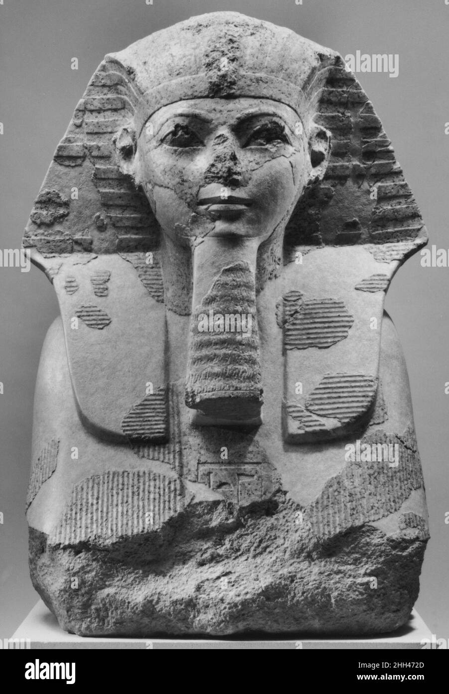 Head and Shoulders of a Sphinx of Hatshepsut ca. 1479–1458 B.C. New Kingdom This fragmentary sphinx represents the female pharaoh Hatshepsut. Portions of six granite sphinxes were discovered during the Museum's excavations in the area of Hatshepsut's mortuary temple at Deir el-Bahri in Western Thebes. A nearly complete example (31.3.166) is on display in gallery 131. This sphinx still retains substantial blue paint on the royal beard, traces of yellow paint on the pleats of the nemes-headcloth, and small amounts of paint around the eyes.A smaller sphinx in a different style is also owned by th Stock Photo