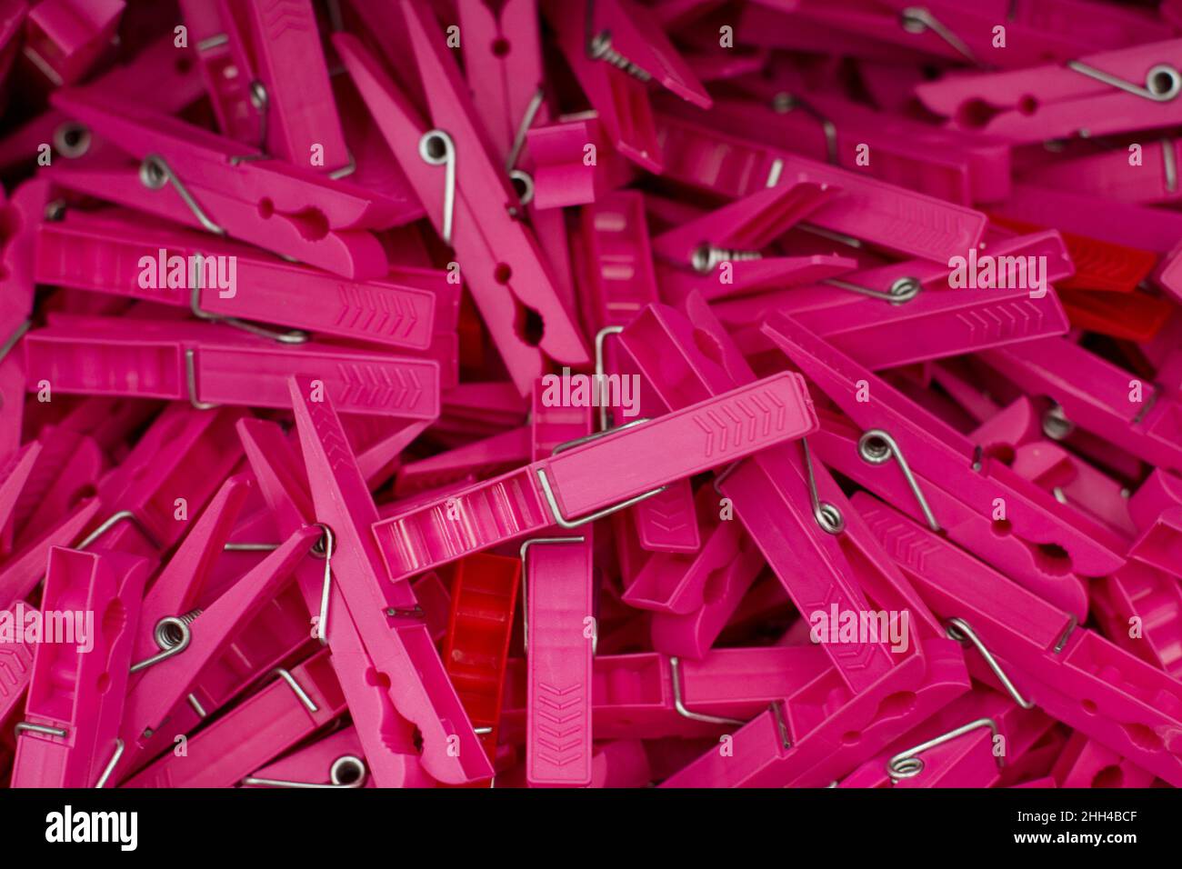 View of several decorative scattered pinned colorful push pins isolated on a white background. Selective focus. Stock Photo