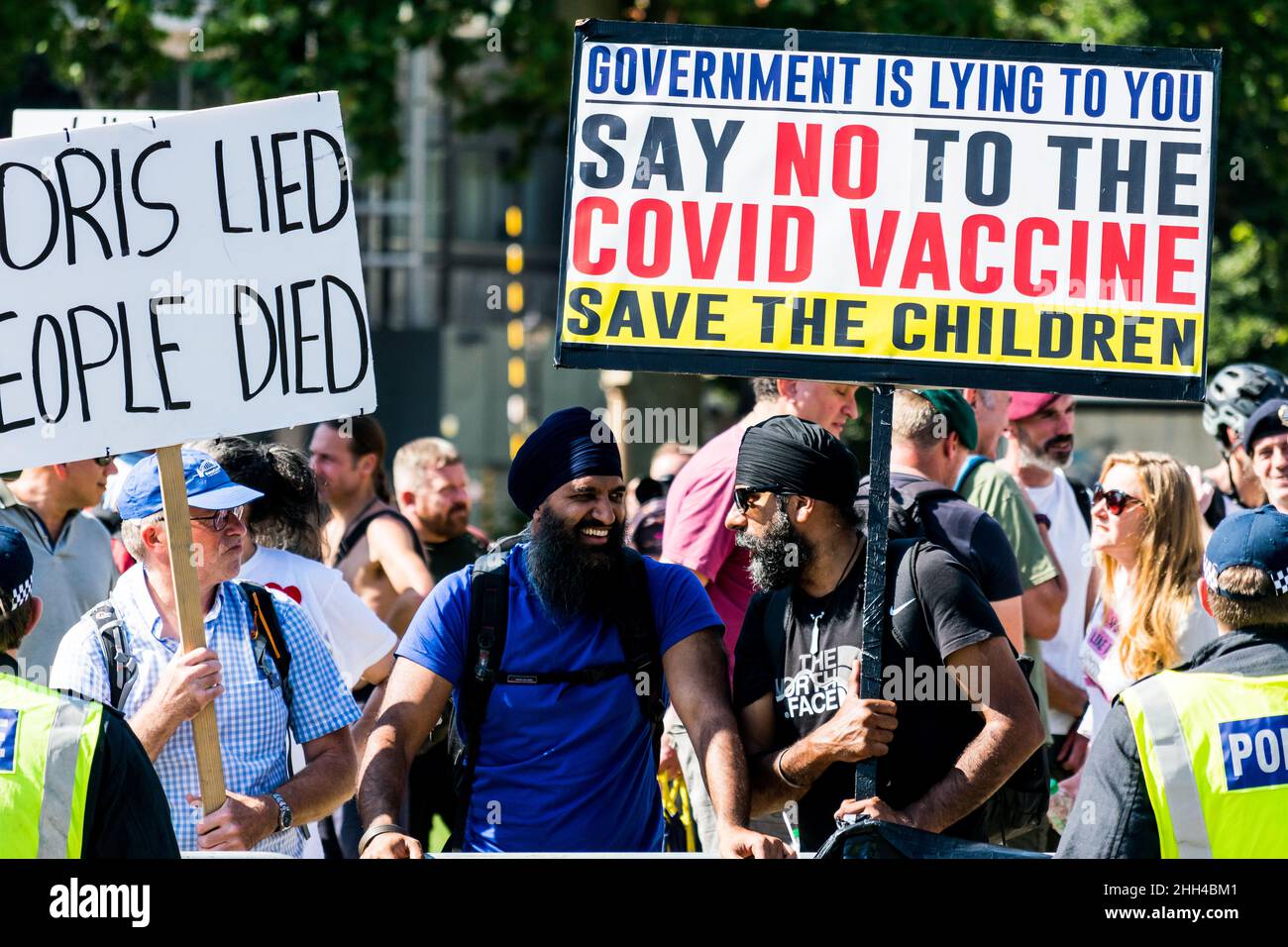 Anti Vaxers demonstrate in Westminster below the statue of Winston Churchill Stock Photo