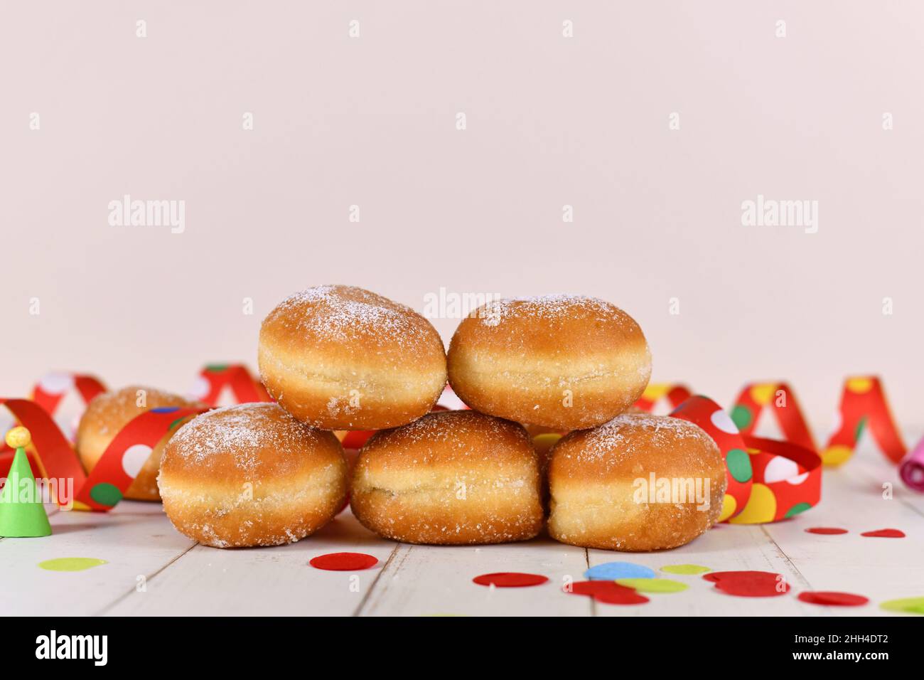 German traditional 'Berliner Pfannkuchen', a donut without hole filled with jam. Traditional served during carnival. Stock Photo
