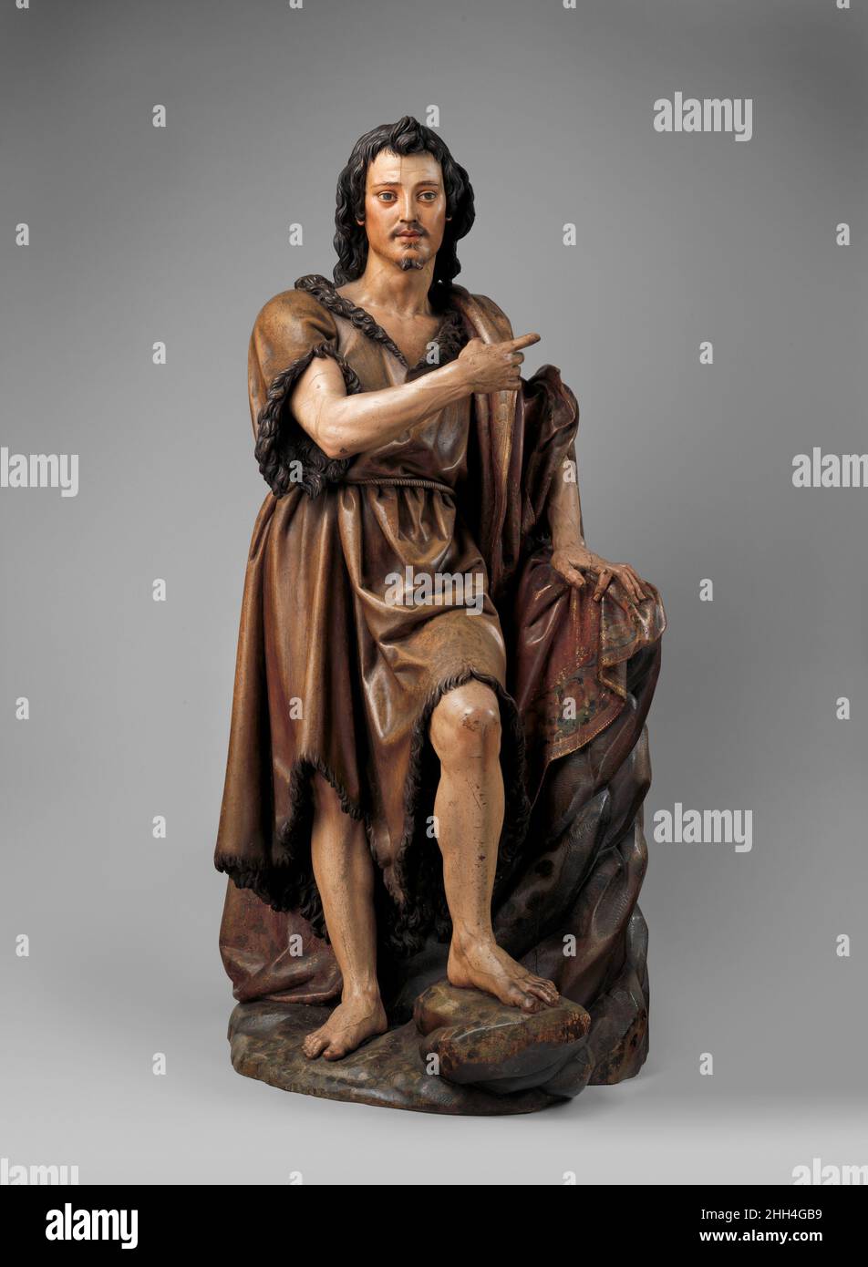 Saint John the Baptist ca. 1620–30 Juan Martínez Montañés Spanish Juan Martínez Montañés was one of the greatest spanish sculptors of the first half of the seventeenth century. Based in Seville, he carved numerous wooden statues and reliefs that were painted and integrated into large altar screens called retablos (English: retables) for churches in his native region or to be shipped to the New World. His forte as an artist was the single figure, standing or seated, usually robust, naturally posed, and richly robed. Somewhat defensively, he gave his reason for this: 'As for the appearance of th Stock Photo
