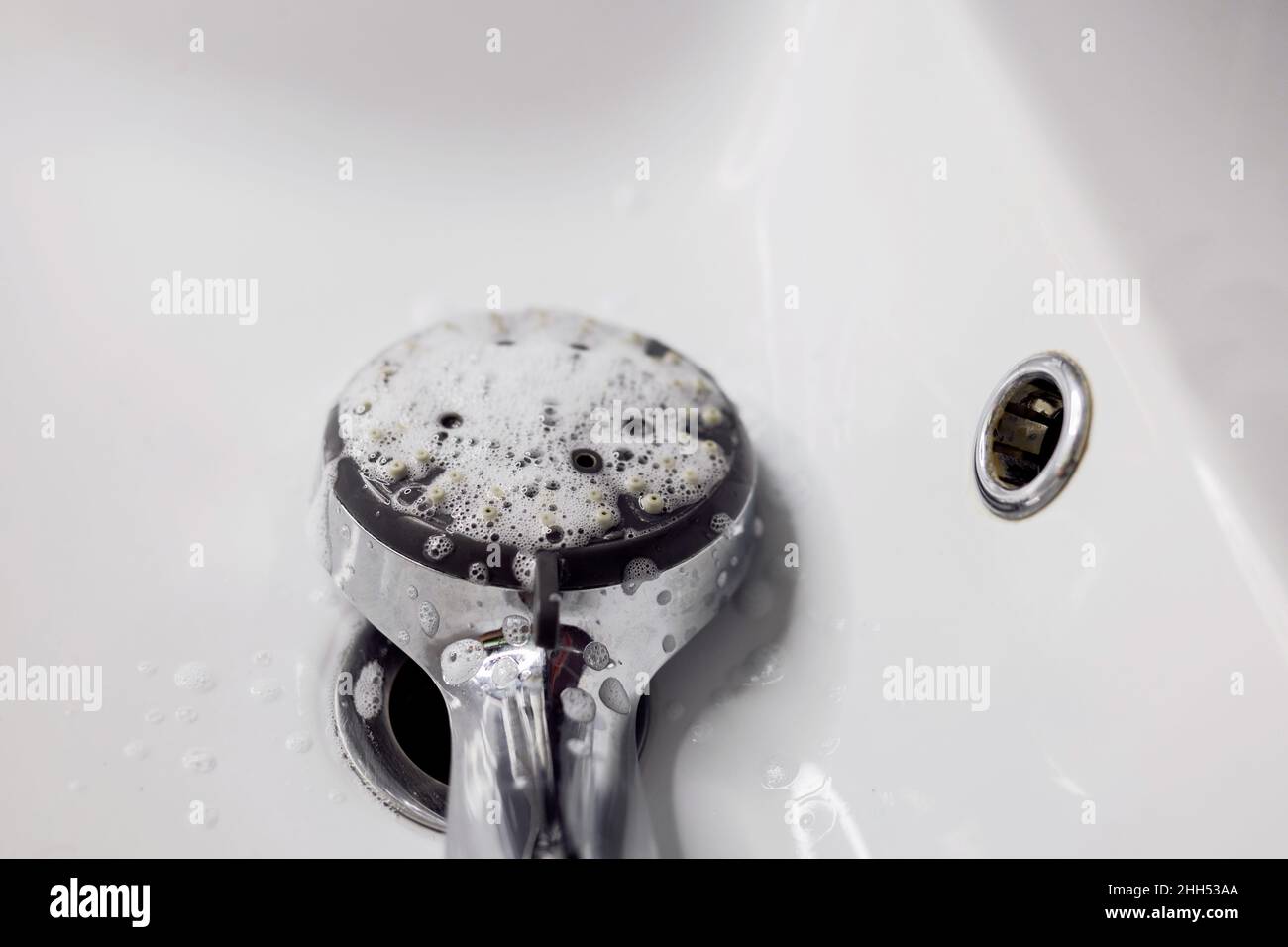Cleaning shower head. Lime deposits on the tap Stock Photo Alamy