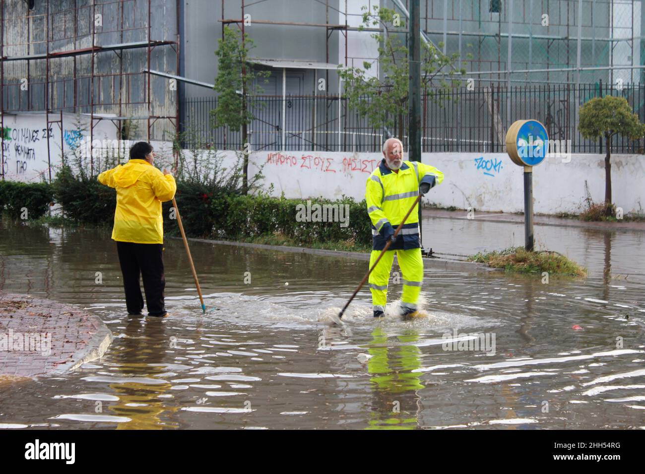 Cleaning up flooded street after heavy rainfall - Spata, Attica, Greece, October 31 2019 Stock Photo