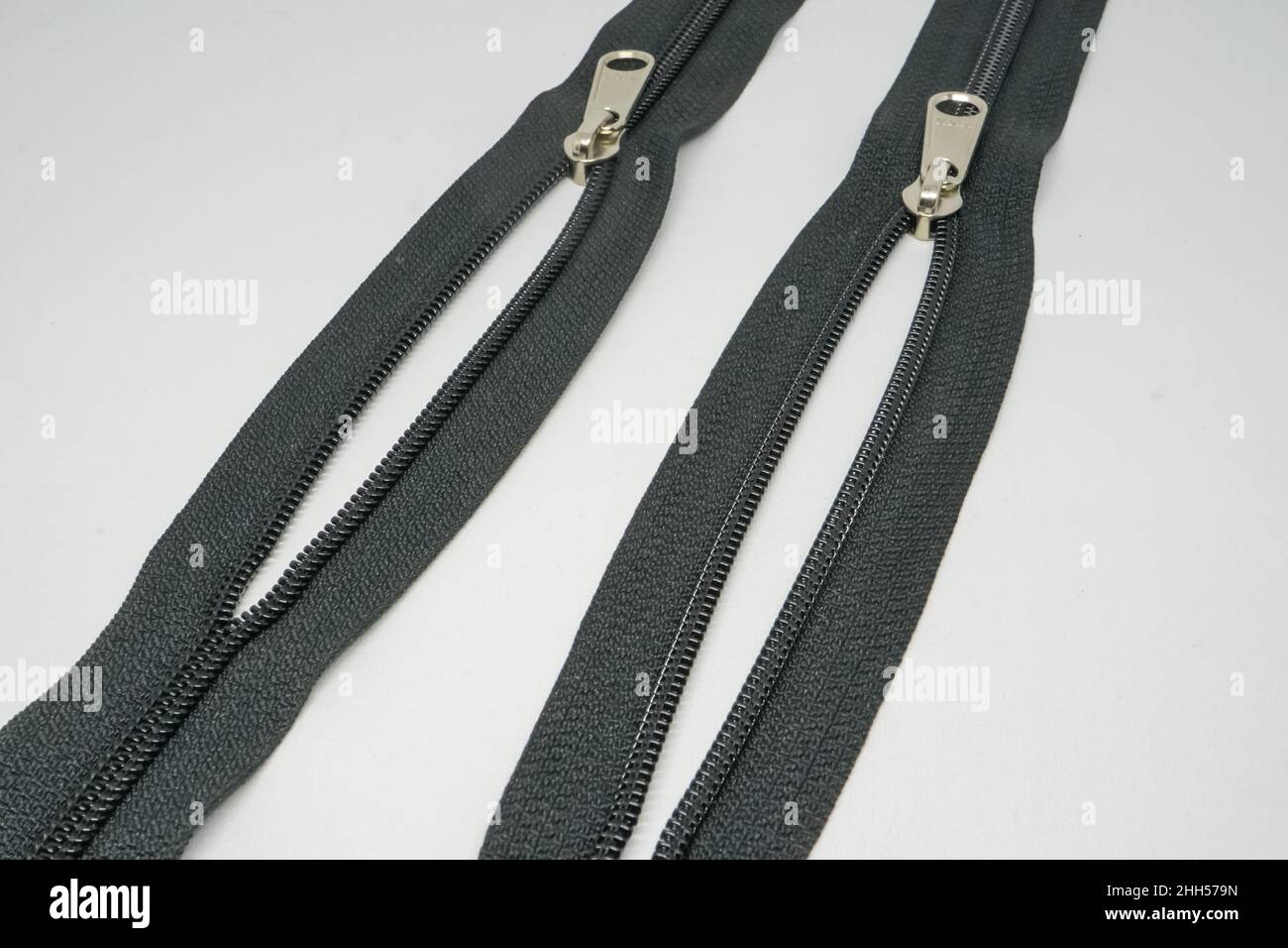 A zipper, zip, fly, or zip fastener, formerly known as a clasp locker, is a commonly used device