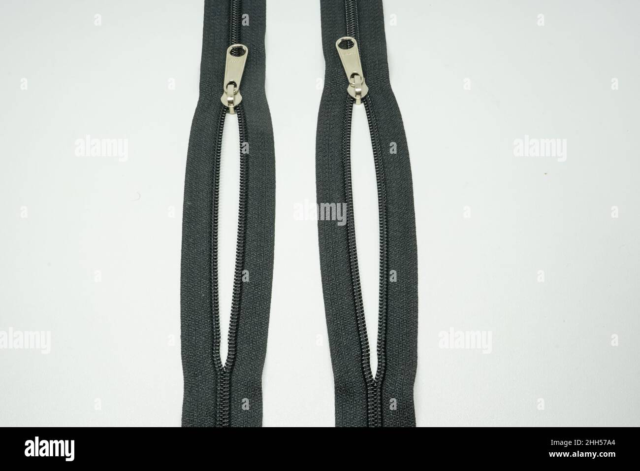 A zipper, zip, fly, or zip fastener, formerly known as a clasp locker, is a commonly used device