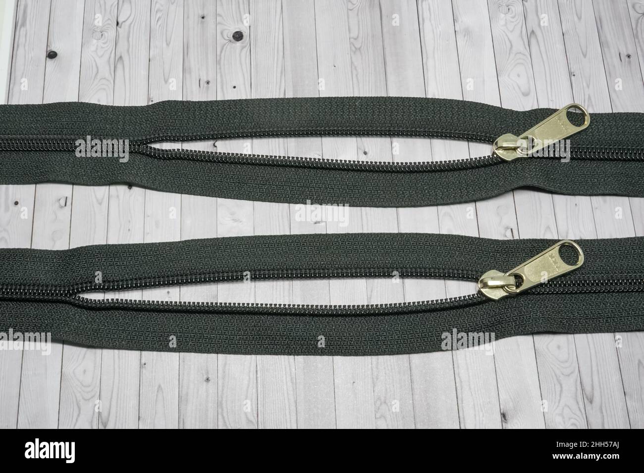 A zipper, zip, fly, or zip fastener, formerly known as a clasp locker, is a commonly used device