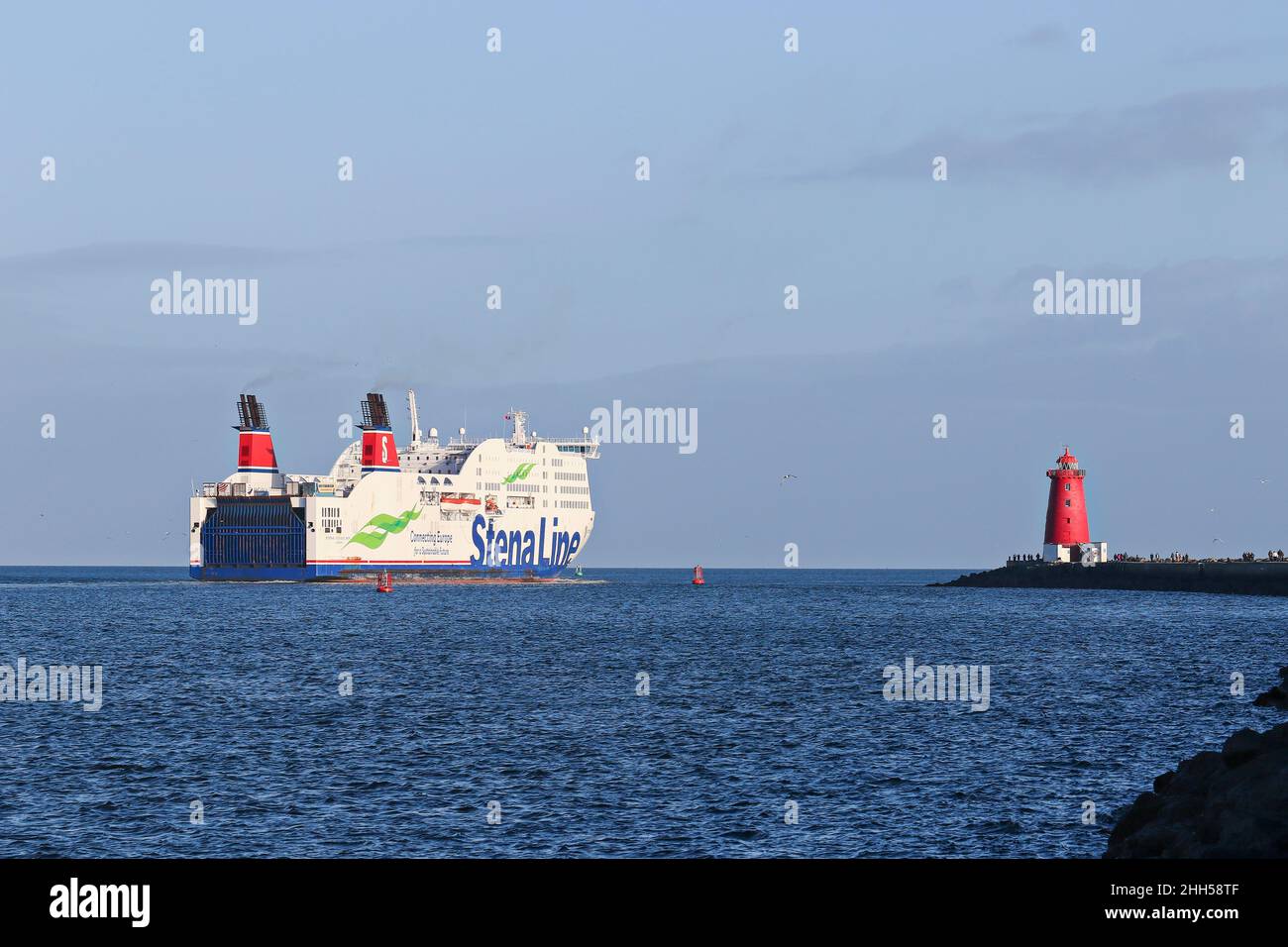 Stena line ferry sails past red Poolbeg lighthouse as it departs Dublin