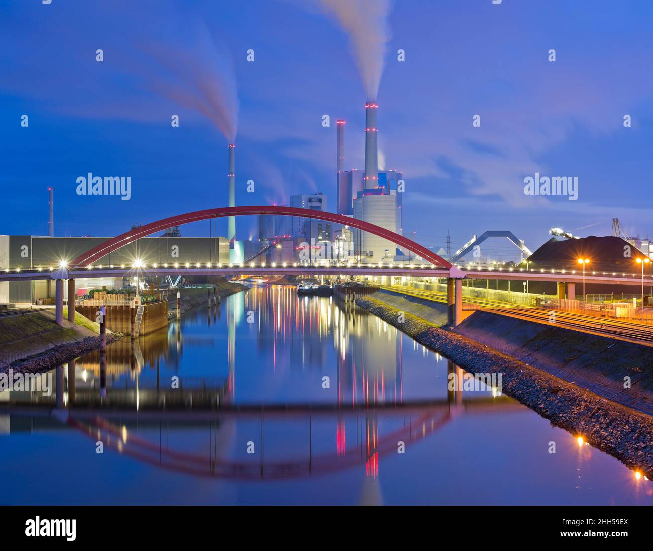 Large illuminated coal station causing global warming and climate change Stock Photo