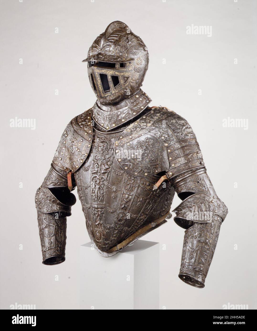 Armor of the Dukes of Alba ca. 1575–85 Lucio Piccinino Italian This is one of the few armors attributable to Lucio Piccinino, the last of the great Italian armor embossers. Distinctive of Piccinino's style is the covering of the armor surface with a dense network of embossed ornament with vertical bands connected laterally by swags of acanthus and fruit. Originally, the steel ground was blued and highlighted with gold and silver damascening. Although damaged by fire in the nineteenth century, this armor amply demonstrates Piccinino's skill in designing a complex program of Classically inspired Stock Photo