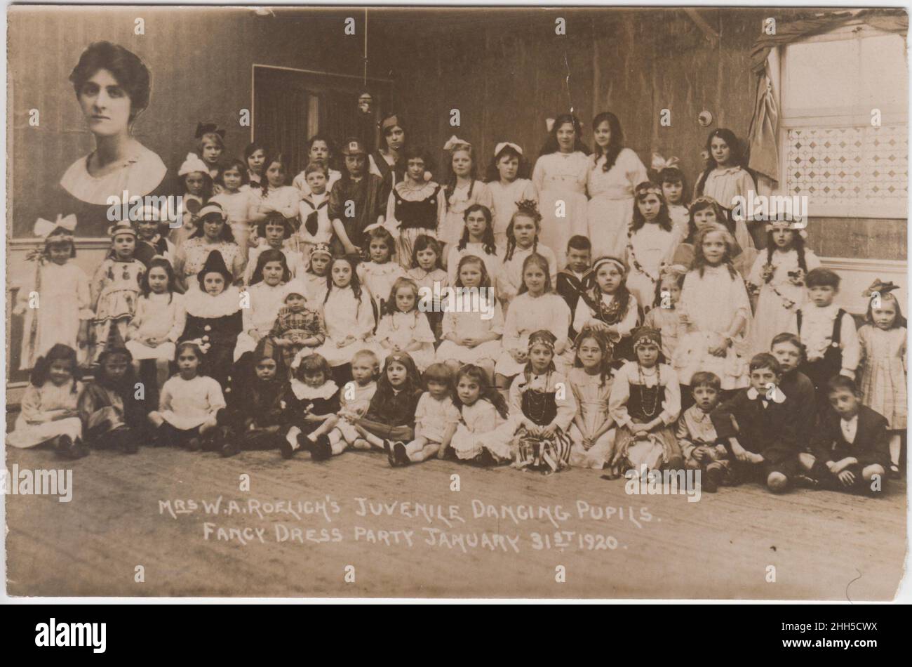 Mrs W.A. Roelich's juvenile dancing pupils, fancy dress party, 31 January 1920: group photograph of children in fancy dress with inset photo of their teacher Stock Photo