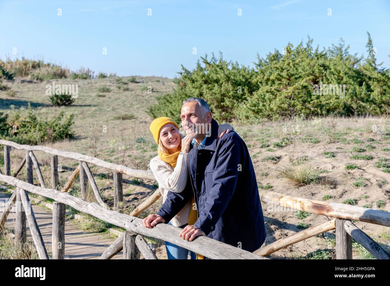 Couple leaning bridge hi-res stock photography and images - Alamy