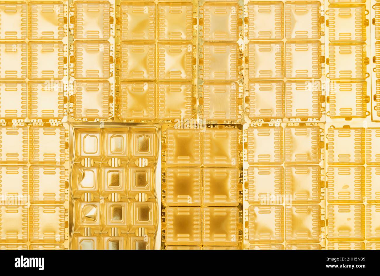 Full frame of gold colored plastic packaging Stock Photo