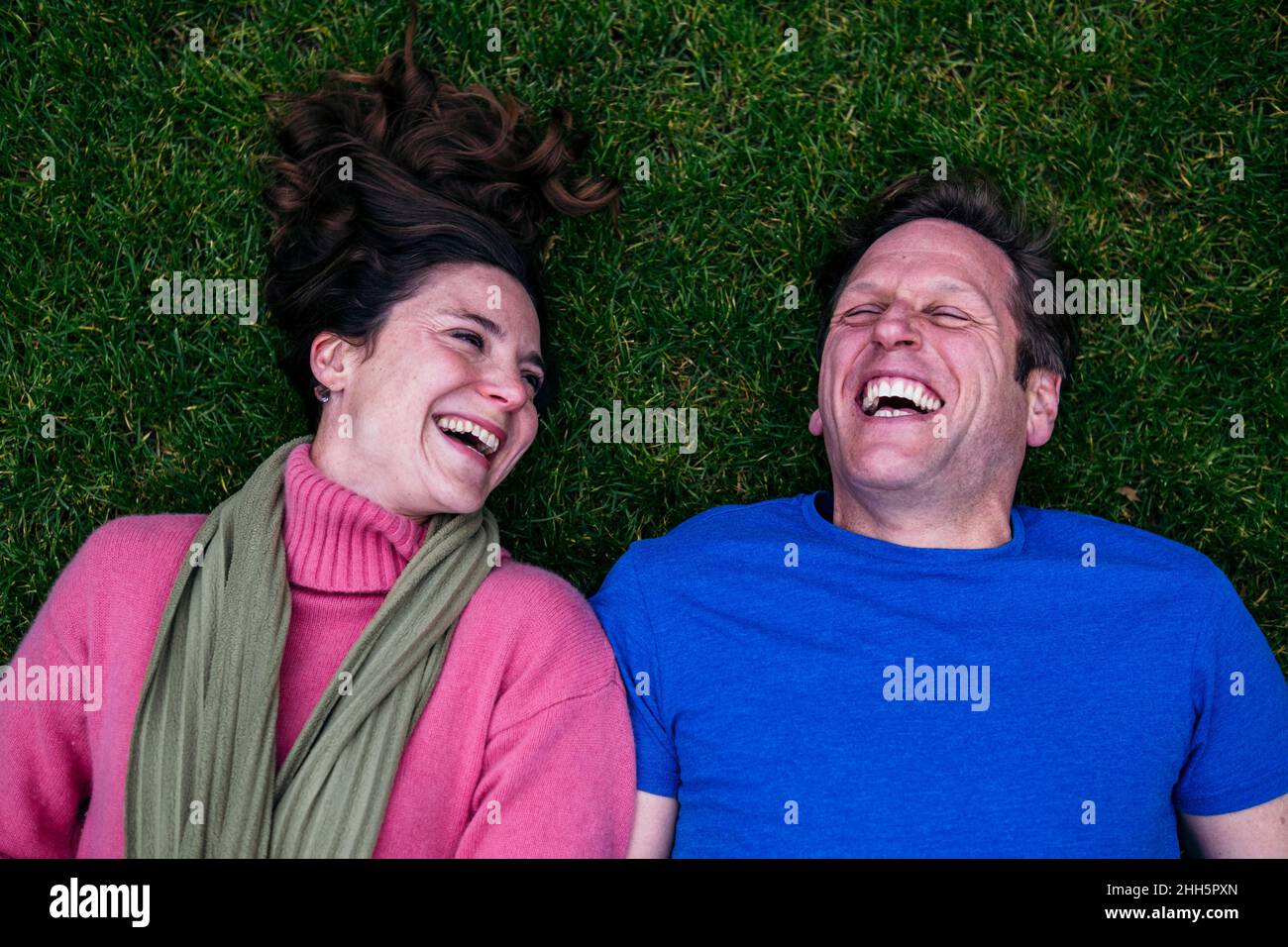 Mature couple lying grass hi-res stock photography and images - Alamy