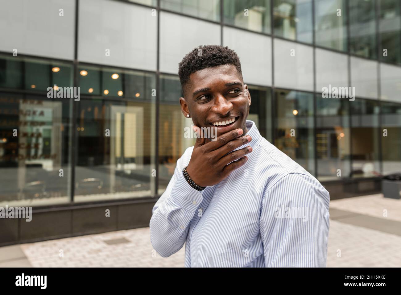 Man chin hand touching hi-res stock photography and images - Alamy