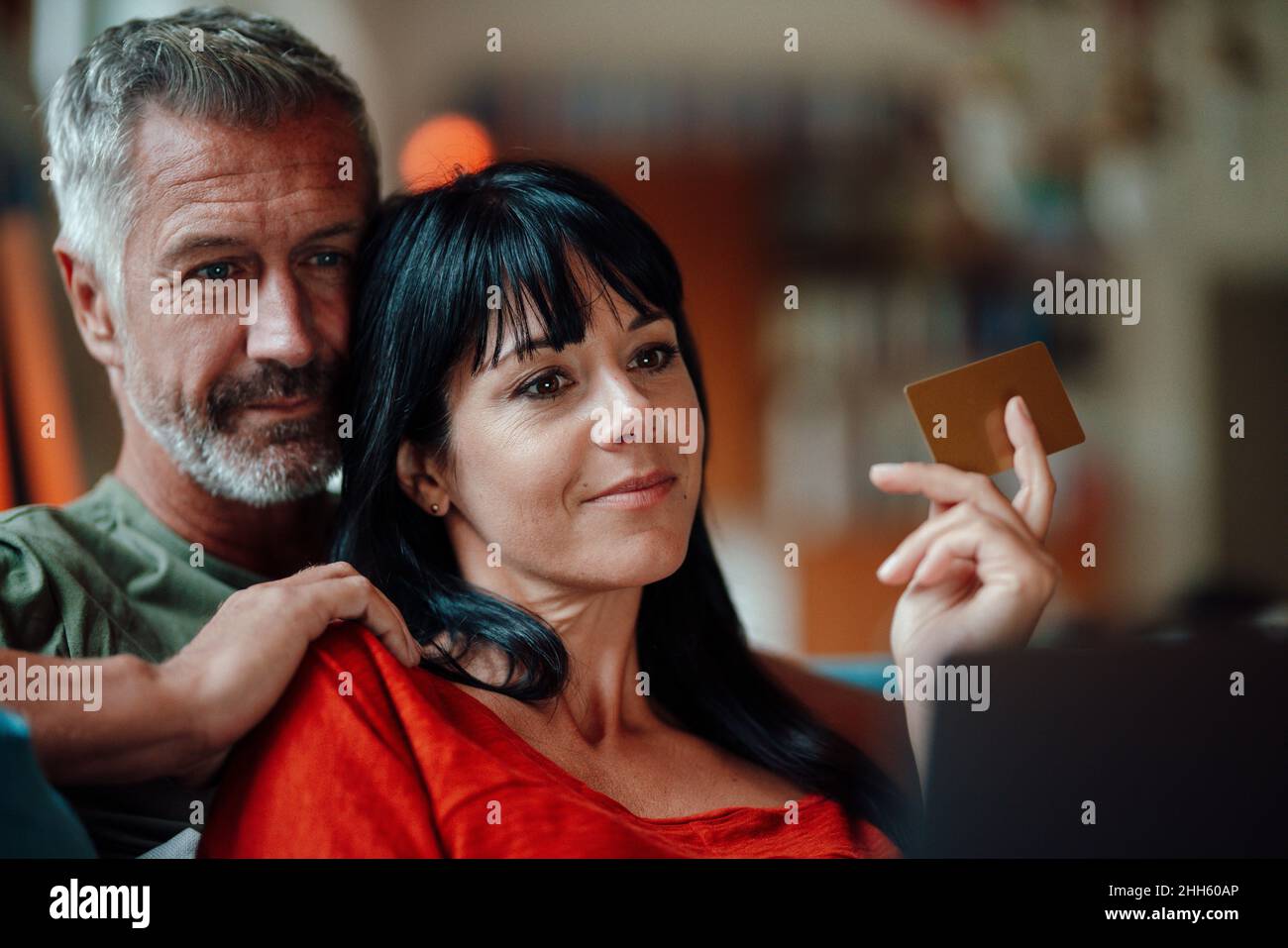 Heterosexual couple doing online shopping on tablet PC at home Stock Photo