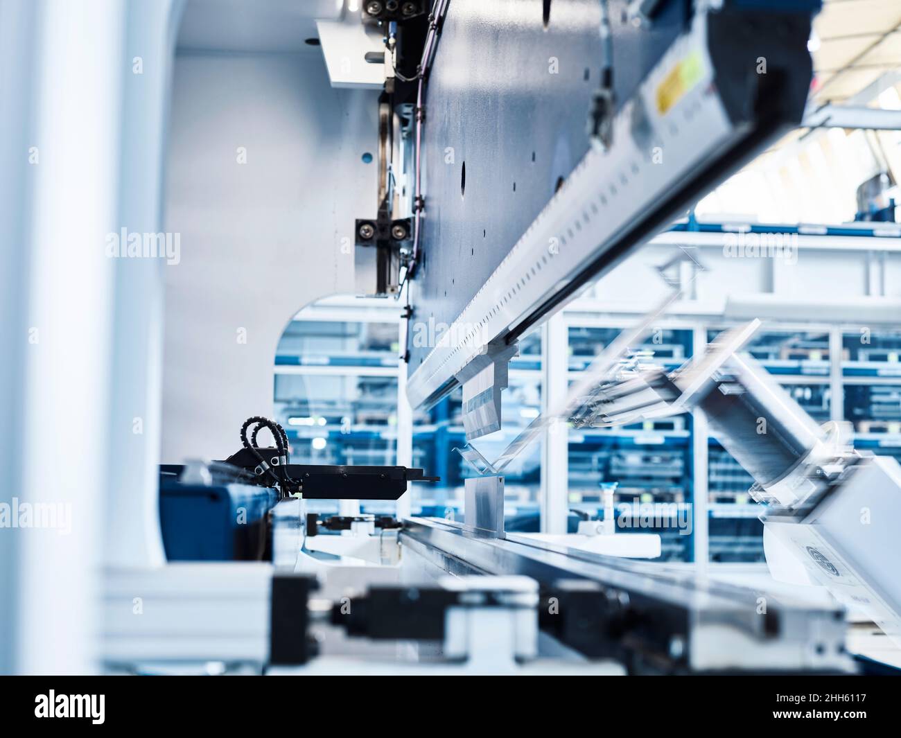 Manufacturing robotic arm in automated factory Stock Photo