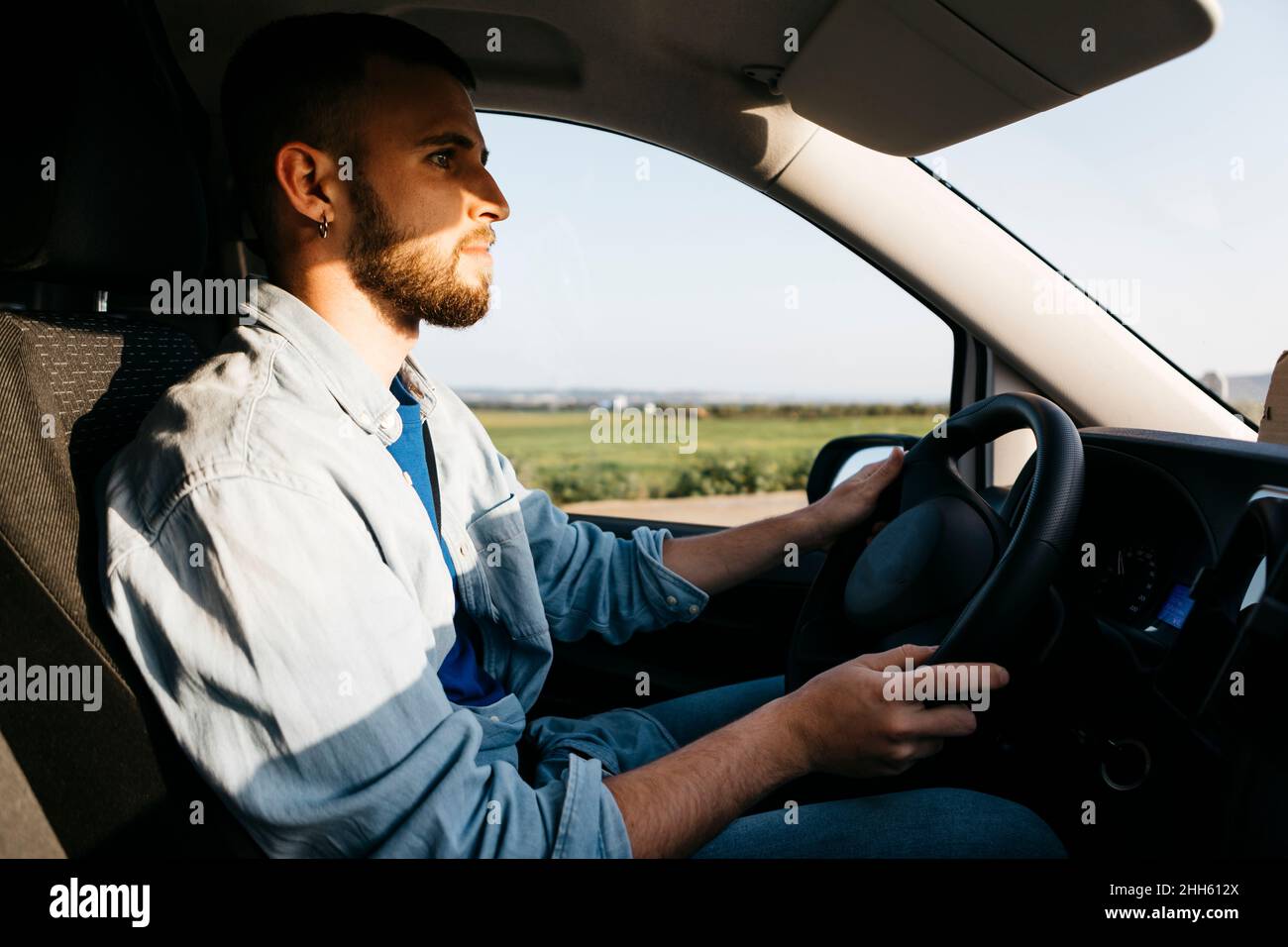 Young man driving van Stock Photo