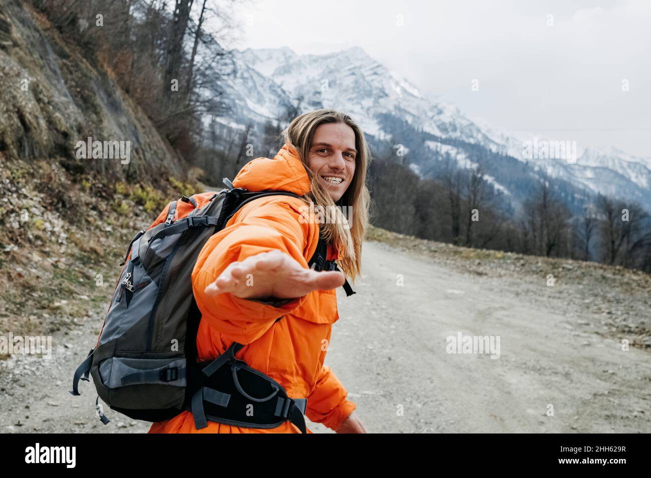 Male hiker walking on road hi-res stock photography and images - Alamy