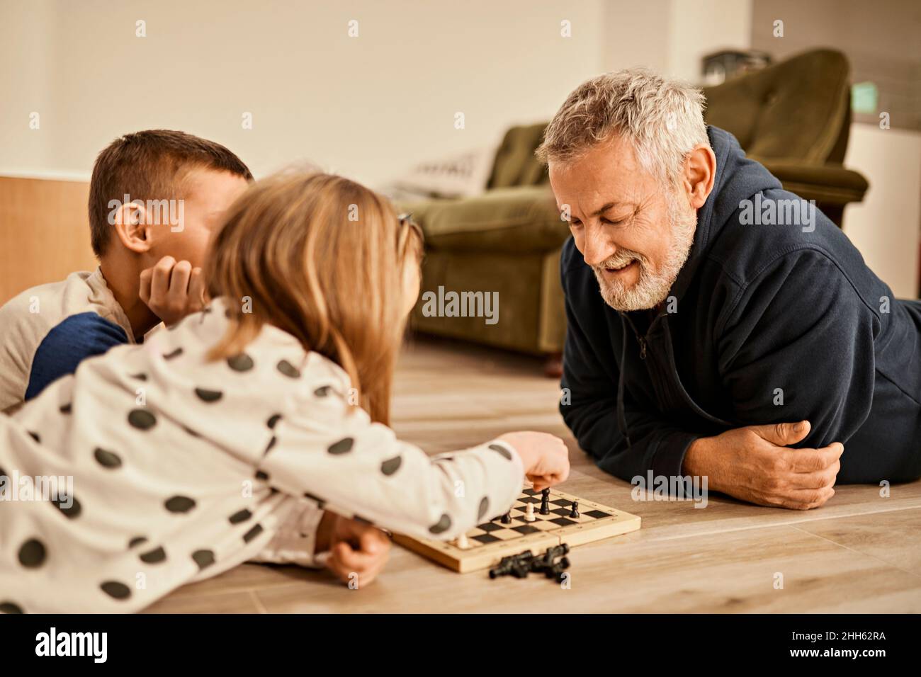 Teenager Playing Chess with his Grandfather · Free Stock Photo