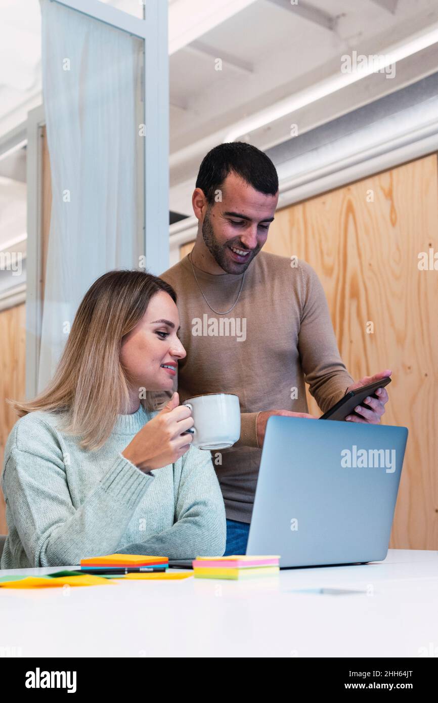 Business colleagues working over tablet PC in studio Stock Photo