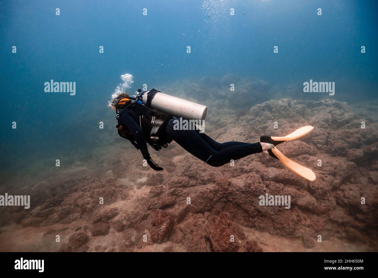 Woman swimming undersea at Del Coco beach Stock Photo