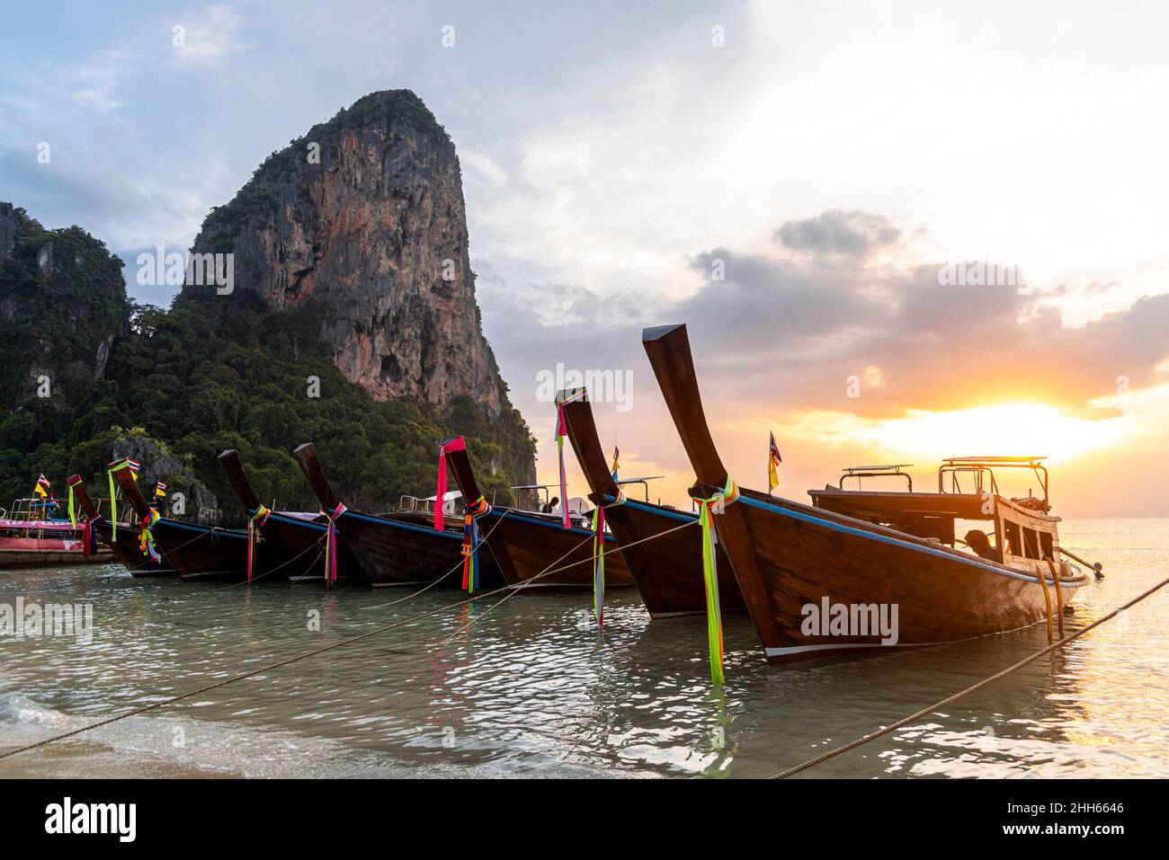 Longtail boats moored on shore at Railay beach, Krabi Province, Thailand Stock Photo