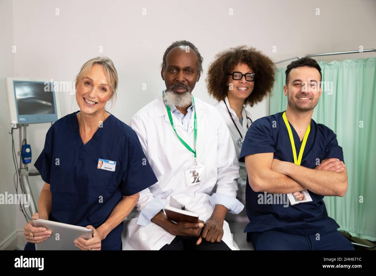Smiling confident multiracial healthcare workers in medical room Stock ...