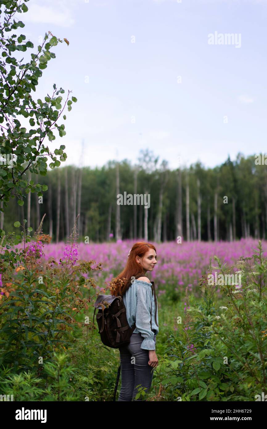 Field Exploring Woman with backpack exploring in field on weekend Stock Photo - Alamy
