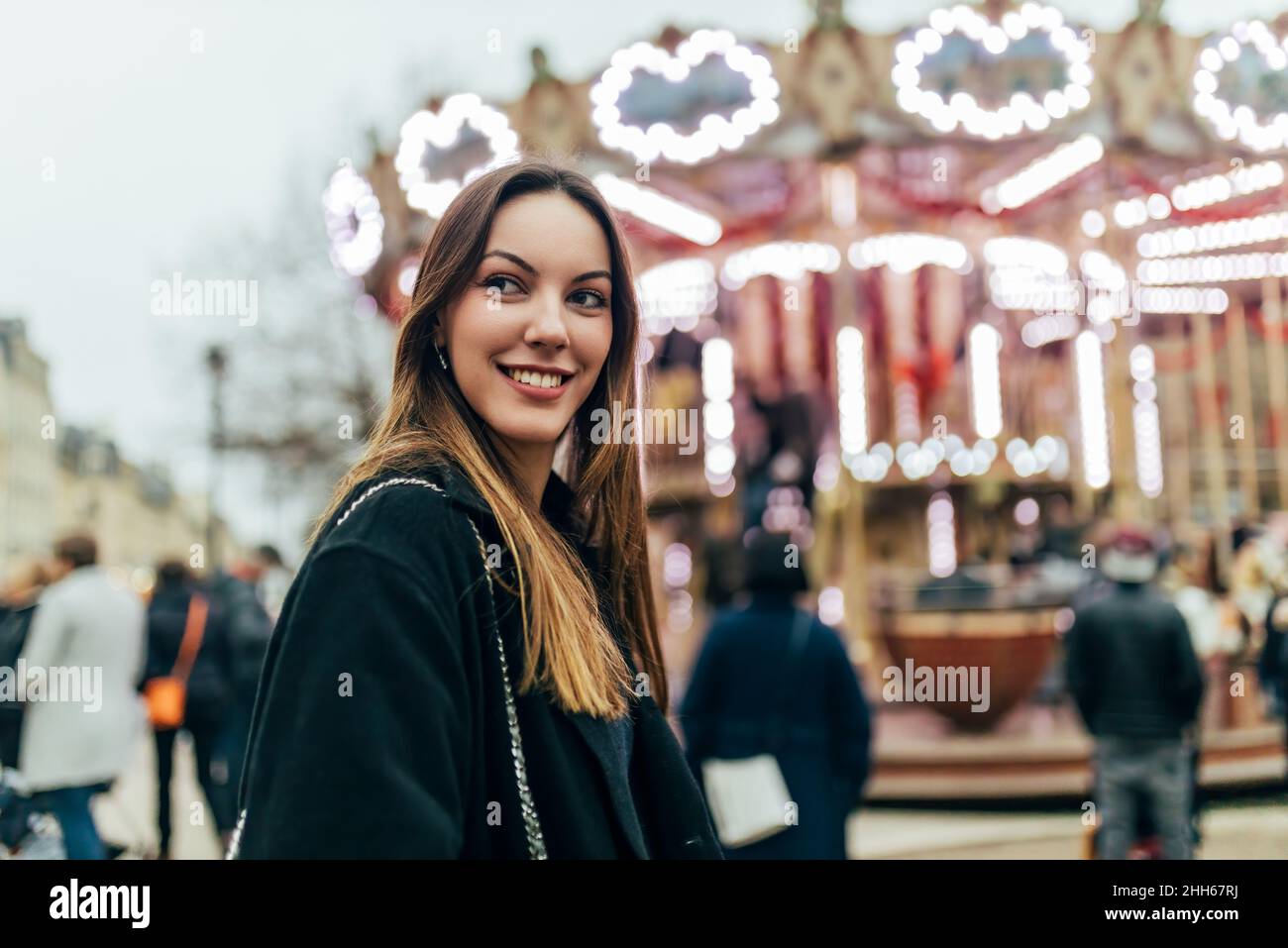 Smiling young woman with long brown hair Stock Photo - Alamy