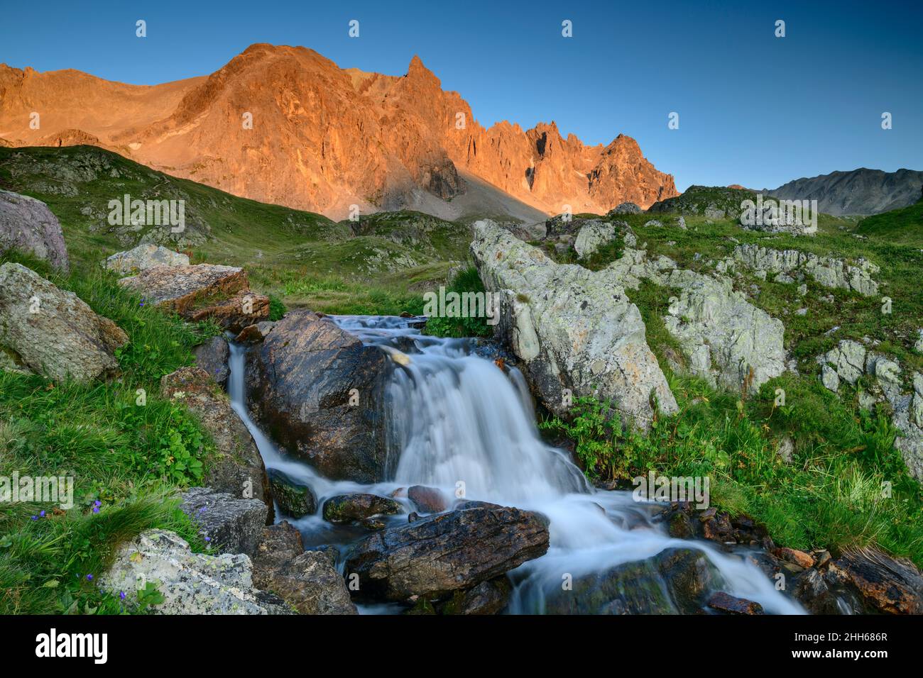 Scenic view of waterfall with Pointe des Cerces in background, France Stock Photo