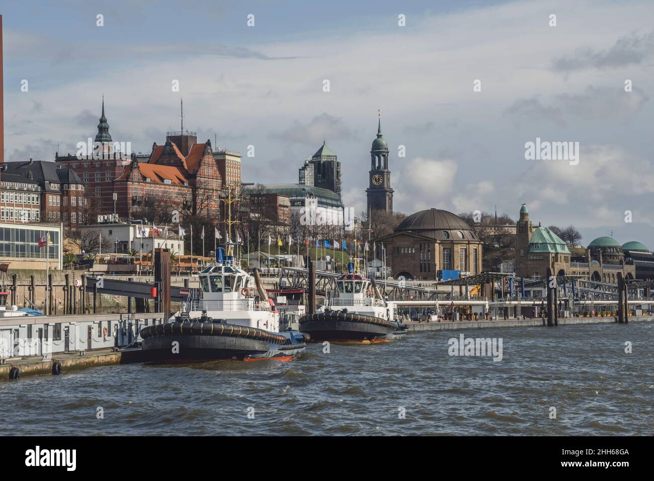 Germany, Hamburg, Tugboats moored along Saint Pauli Piers Stock Photo