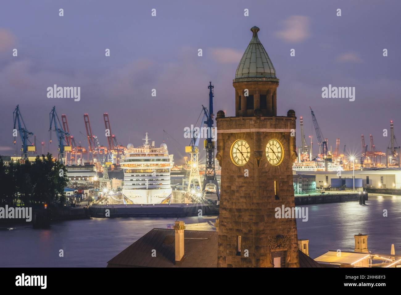 Germany, Hamburg, Saint Pauli Piers clock tower with docked cruise ship in background Stock Photo