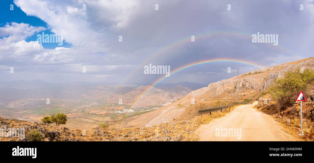 Double rainbow over mountains seen from Mirador Sierra Gorda, Andalucia, Spain, Europe Stock Photo
