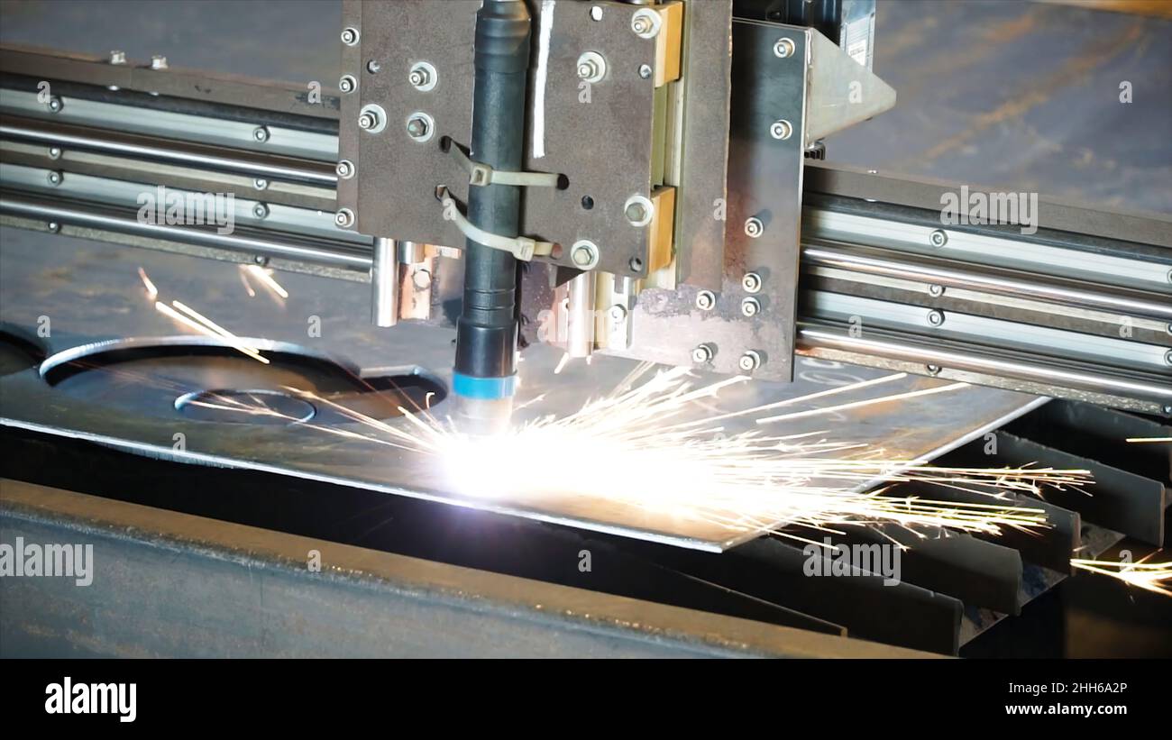 Industrial plasma machine cutting of metal plate. Clip. Cutting metal plates gas cutting. Steel plate cutting by gas machine. Stock Photo