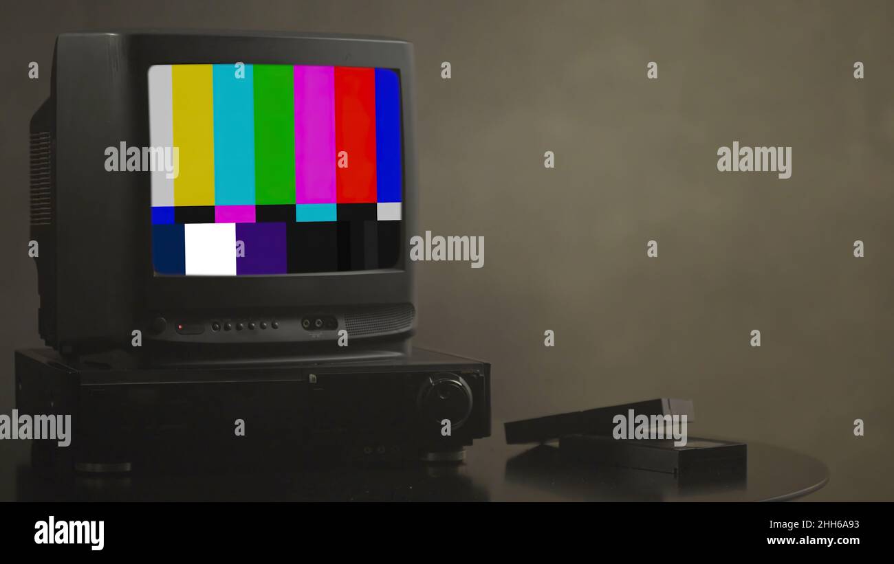 TV test card with rainbow bars, geometric signals. Retro hardware 1980. Glitch art show static error, broken transmission. Stock Photo