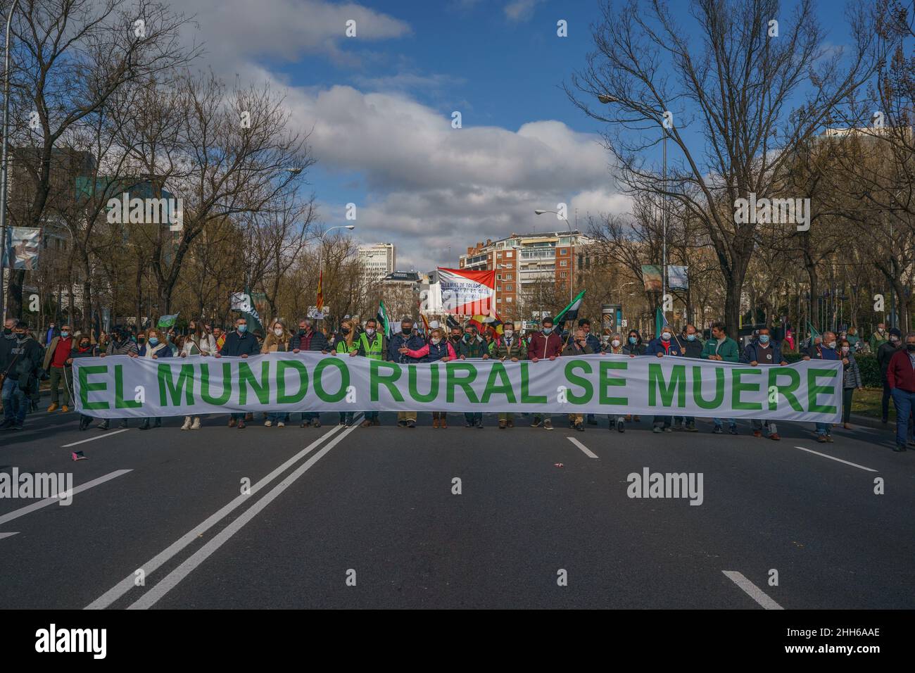 Madrid, Spain. 23rd Jan, 2022. Demonstrators hold a banner that says 'the rural world is dying' during the protest.The association Alma Rural has called the protest under the name of the 'Great Demonstration of the Rural World' in response to the situation suffered by the primary sector and in order to raise awareness in society about the crisis and attacks from different fronts that supports the field and the people working in the sector. In addition, the protest was attended by the sectors and groups affected by the future animal protection law. Credit: SOPA Images Limited/Alamy Live News Stock Photo