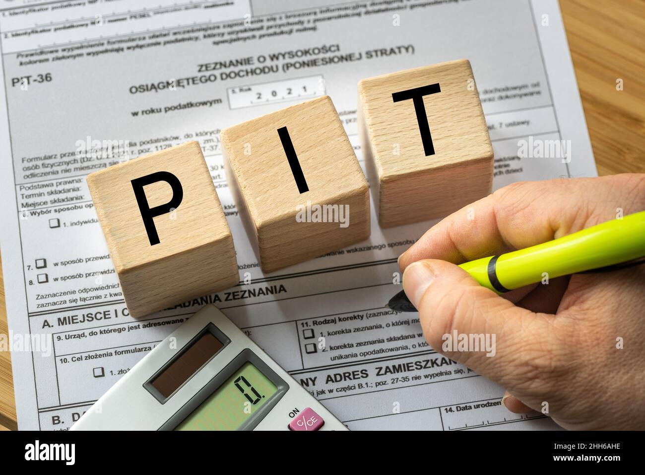 Annual tax settlement in Poland, Form for private persons, Wooden blocks with the word PIT Stock
