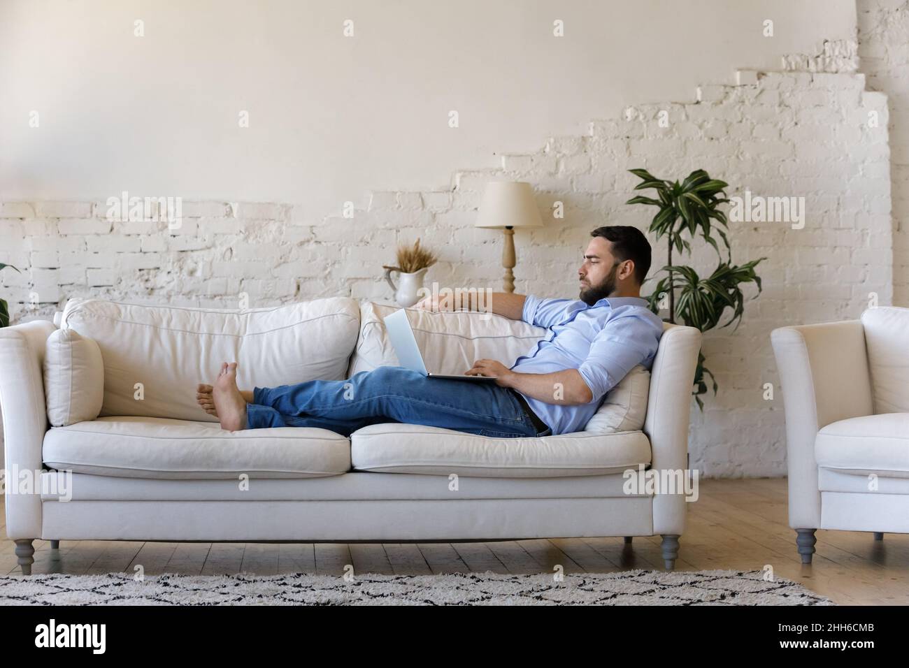 Focused millennial remote employee working from home Stock Photo