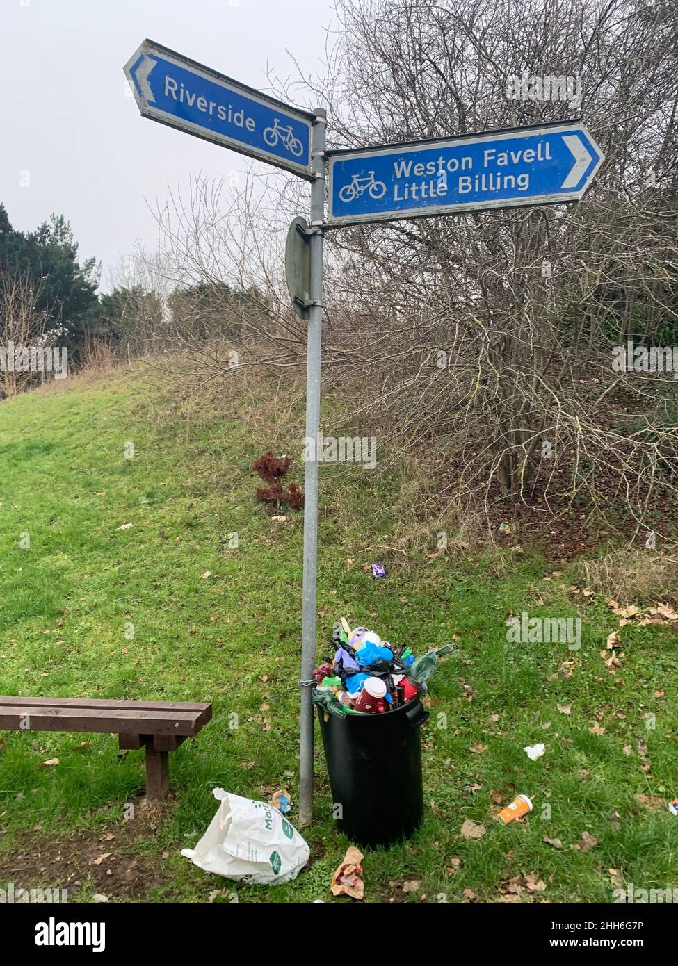 Full rubbish bin and Sign for Riverside and Weston Favell Northampton