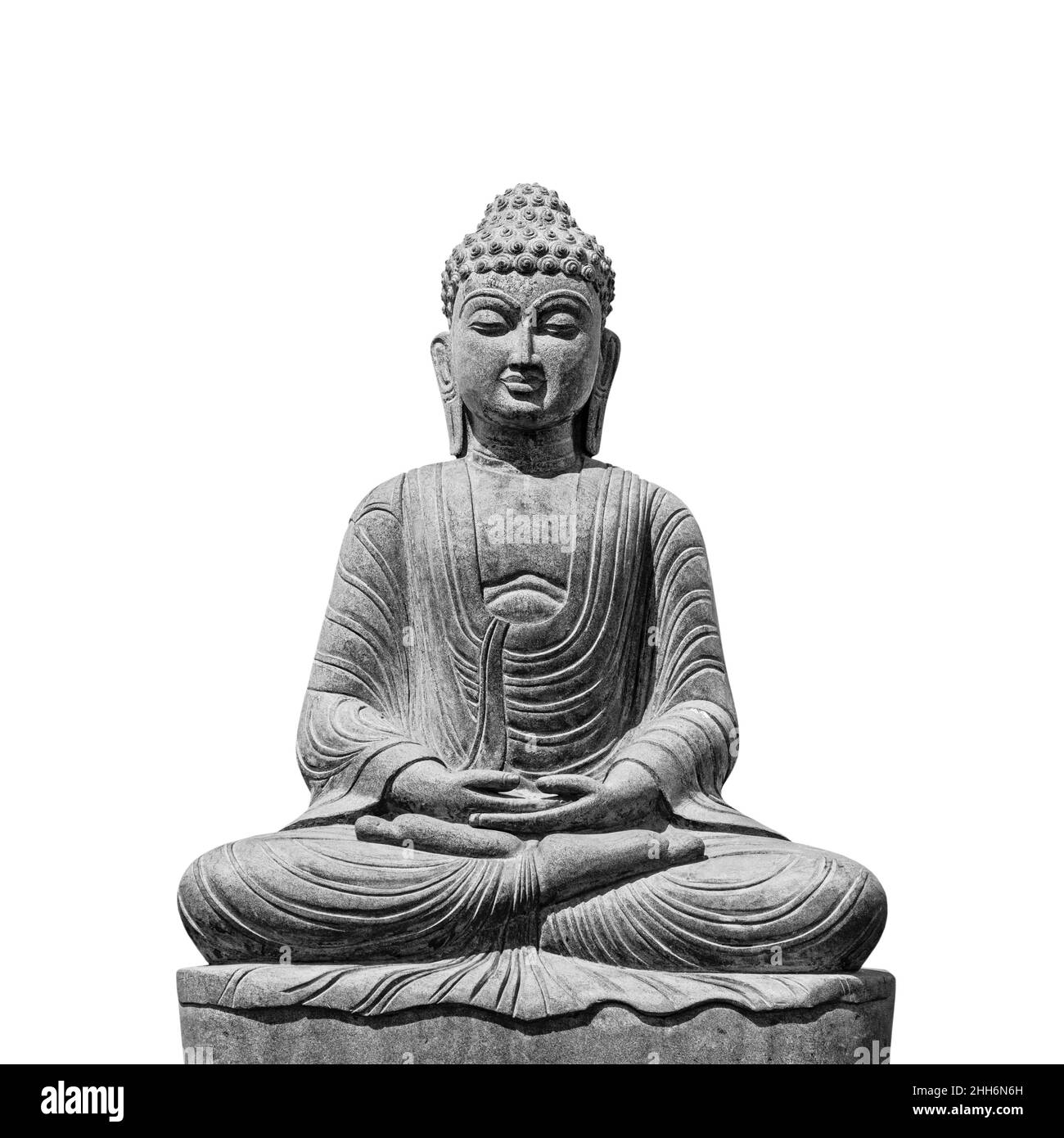 Stone statue of Buddha isolated on white background, front view black and white picture Stock Photo