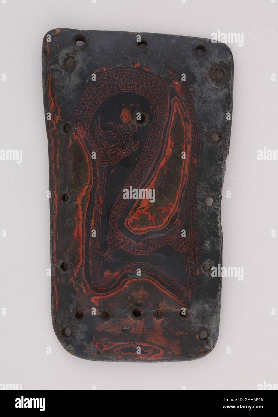 Element from a Lacquered Leather Cuirass 8th–10th century Yi or Nuosu, China (Yunnan or Sichuan). Element from a Lacquered Leather Cuirass. Yi or Nuosu, China (Yunnan or Sichuan). 8th–10th century. Lacquer, leather. Yunnan; Sichuan. Armor for Man Stock Photo