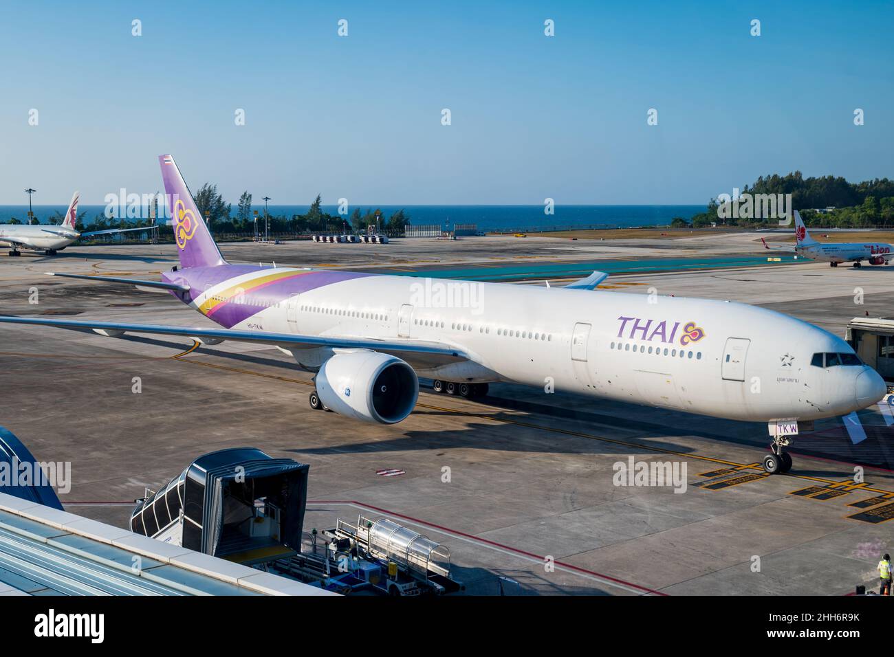 Phuket, Thailand - January 2022: Thai Airways passenger plane at Phuket airport, Thailand. Thai Airways is the flagship carrier of Thailand. Stock Photo