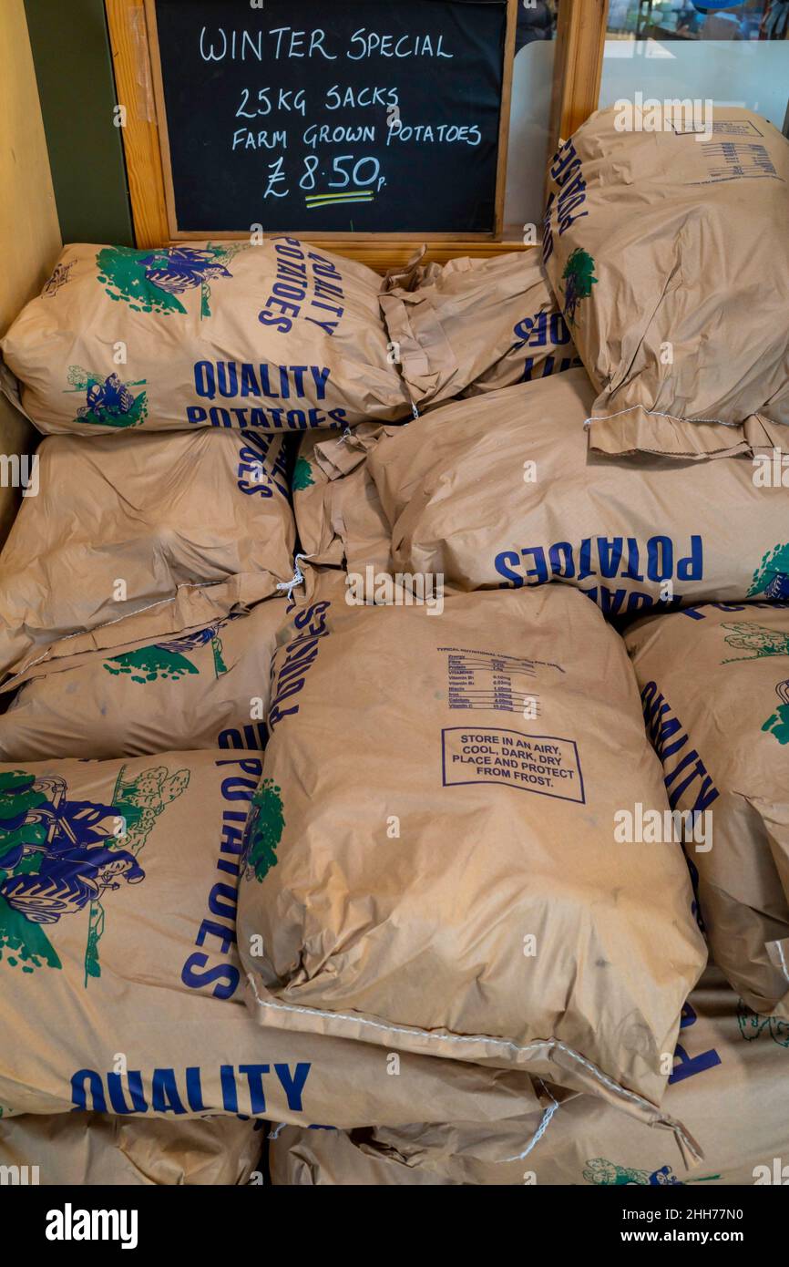 English potatoes in 25kg bags for sale priced at £8.50 in a Yorkshire farm shop January 2022 Stock Photo