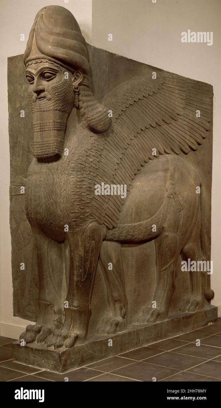 Human-headed winged lion (lamassu) ca. 883–859 B.C. Assyrian From the ninth to the seventh century B.C., the kings of Assyria ruled over a vast empire centered in northern Iraq. The great Assyrian king Ashurnasirpal II (r. 883–859 B.C.), undertook a vast building program at Nimrud, ancient Kalhu. Until it became the capital city under Ashurnasirpal, Nimrud had been no more than a provincial town.The new capital occupied an area of about nine hundred acres, around which Ashurnasirpal constructed a mudbrick wall that was 120 feet thick, 42 feet high, and five miles long. In the southwest corner Stock Photo