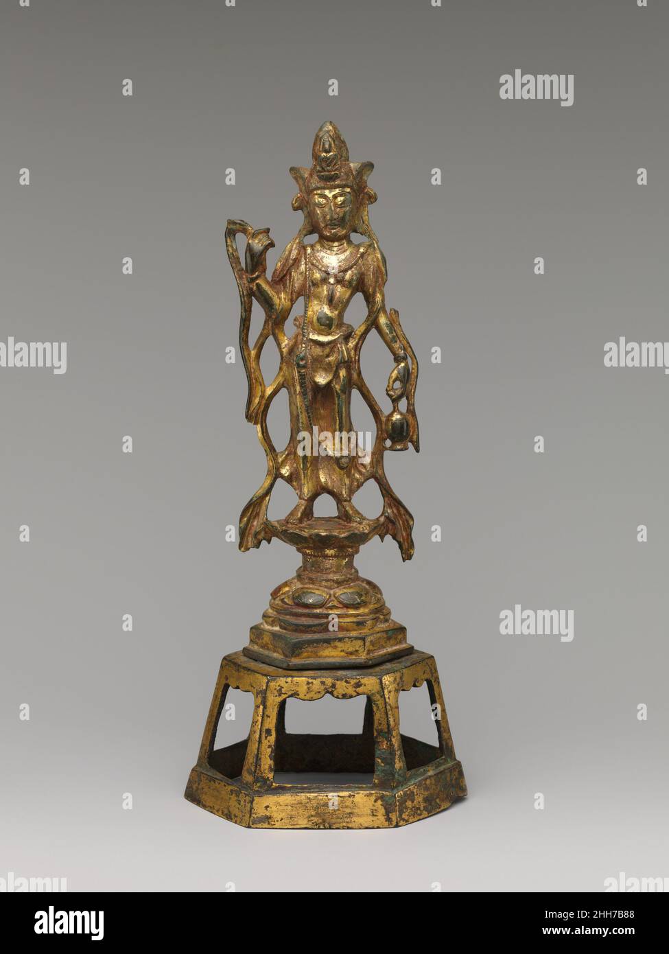 Bodhisattva Avalokiteshvara (Guanyin) late 7th–early 8th century China. Bodhisattva Avalokiteshvara (Guanyin). China. late 7th–early 8th century. Gilt bronze. Tang dynasty (618–907). Sculpture Stock Photo