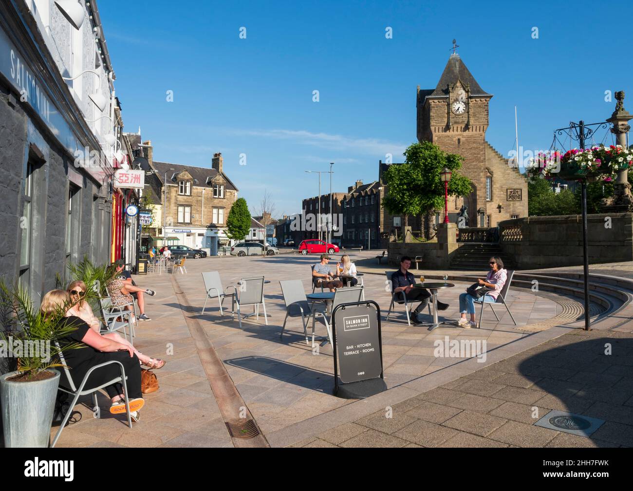 Galashiels, Selkirkshire, Scotland - the town hall and the Salmon Inn with outdoor seating in summer. Stock Photo