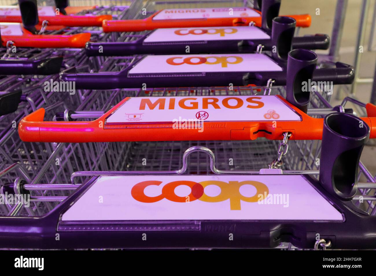 Herzogenbuchsee, Switzerland, 03. January 2022: Shopping Carts of the two biggest competing Companys Coop and Migros. Stock Photo