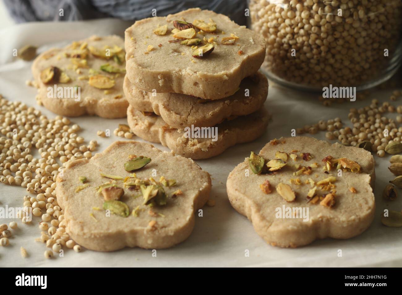 Sorghum ghee cookies. Ghee cookies with sorghum flour garnished with pistachios. Commonly called Nankhatai. A shortbread biscuits originating from the Stock Photo
