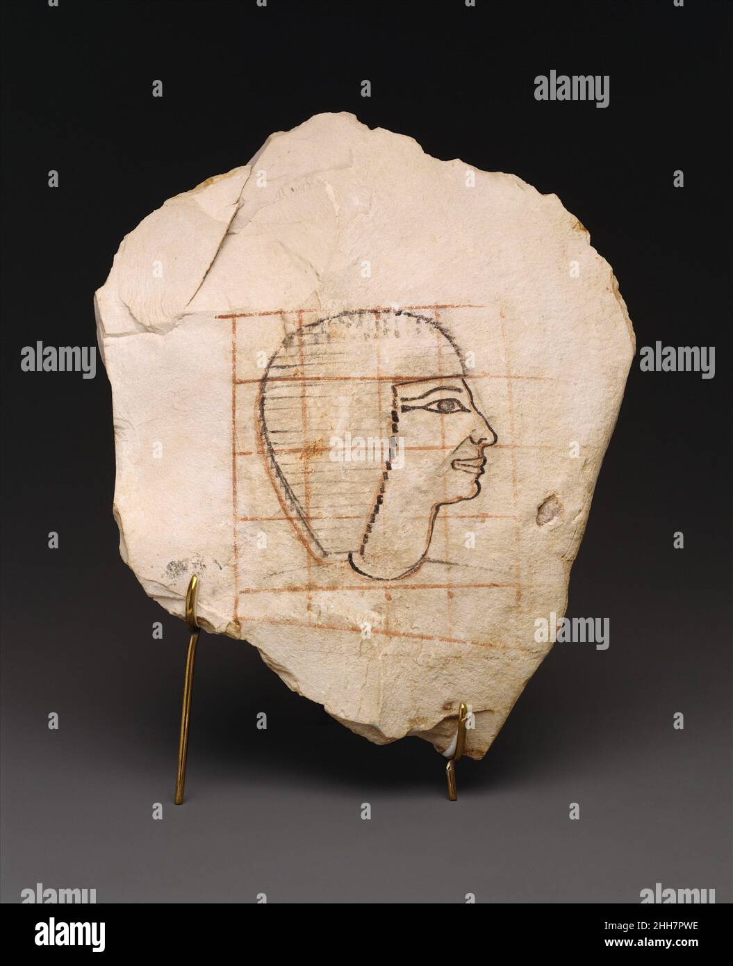 Artist's Gridded Sketch of Senenmut ca. 1479–1458 B.C. New Kingdom This gridded sketch of a man wearing a short wig undoubtedly depicts Senenmut, one of Hatshepsut's most valued officials. His appointment to a large number of important offices, such as steward of the god Amun at Karnak, enabled him to afford the excavation of an elaborate funerary complex consisting of an offering chapel (TT 71) and a tomb (TT 353) not far from Hatshepsut's temple at Deir el-Bahri in western Thebes. He also created a tomb for his mother, Hatnefer (36.3.1), and other family members on the hillside below.This li Stock Photo