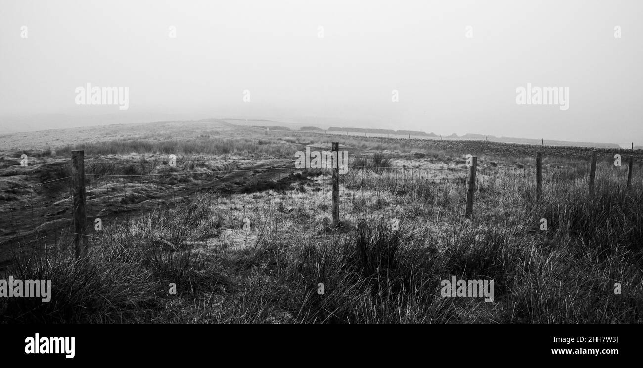 A misty, desolate field in the Peak District countryside. Stock Photo